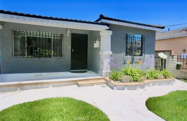 1526 Lakme Ave, Wilmington, CA 90744 - view of exterior entry with stucco siding