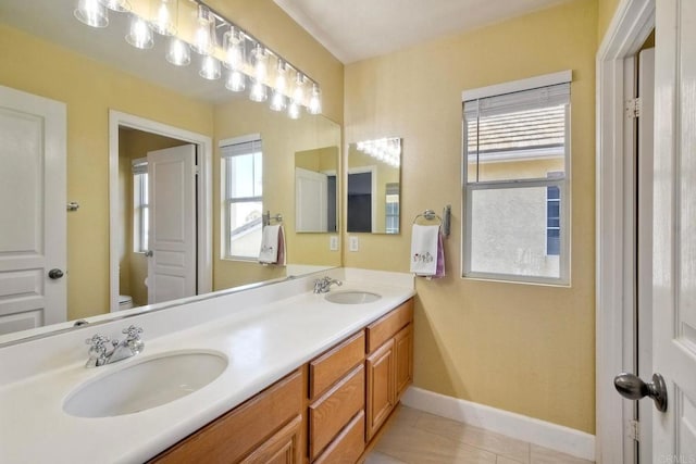 756 River Rock Rd, Chula Vista, CA 91914 - full bathroom featuring healthy amount of natural light, double vanity, and tile patterned floors