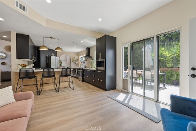 136461/2 Dronfield Ave, Sylmar, CA 91342 - living area featuring light wood finished floors and recessed lighting