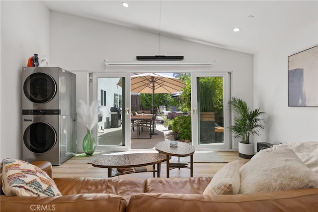 136461/2 Dronfield Ave, Sylmar, CA 91342 - living room featuring stacked washer / dryer, vaulted ceiling, wood finished floors, and recessed lighting