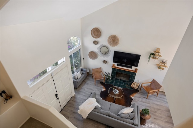 136461/2 Dronfield Ave, Sylmar, CA 91342 - living room with a towering ceiling, wood finished floors, and a fireplace