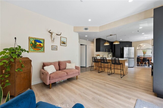 136461/2 Dronfield Ave, Sylmar, CA 91342 - living room featuring light wood-style flooring and recessed lighting