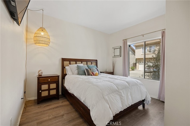 136461/2 Dronfield Ave, Sylmar, CA 91342 - bedroom featuring wood finished floors and baseboards