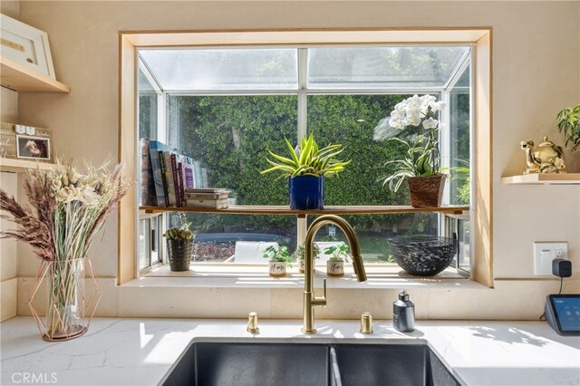136461/2 Dronfield Ave, Sylmar, CA 91342 - kitchen featuring plenty of natural light and light stone counters