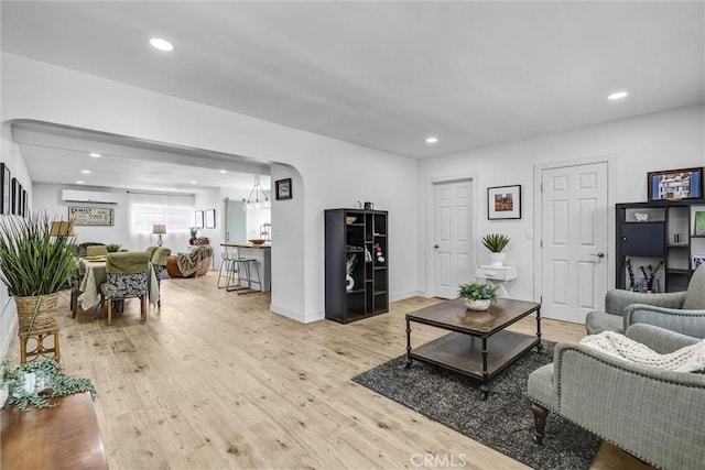 2255 Cota Ave, Long Beach, CA 90810 - living area with light wood-style floors, recessed lighting, and a wall mounted AC