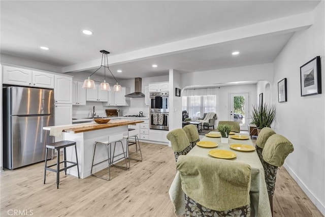 2255 Cota Ave, Long Beach, CA 90810 - dining room with light wood finished floors, beam ceiling, and recessed lighting
