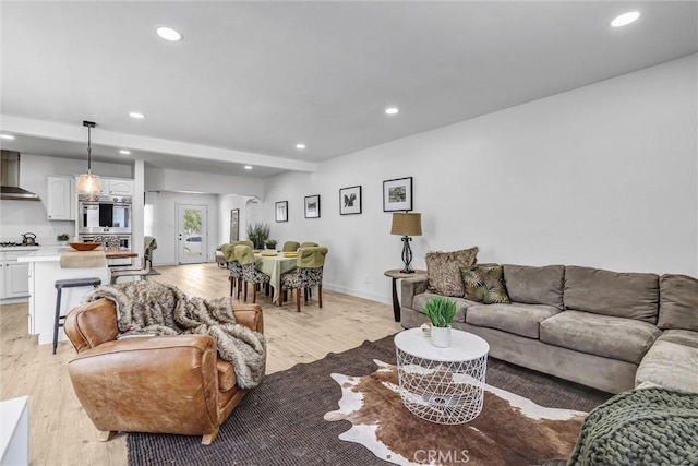 2255 Cota Ave, Long Beach, CA 90810 - living area with light wood-type flooring and recessed lighting