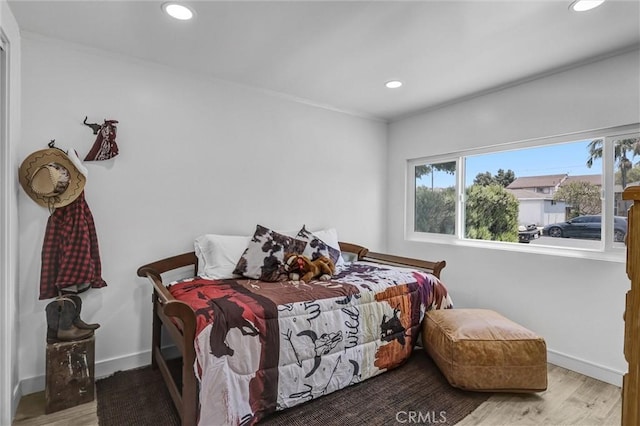 2255 Cota Ave, Long Beach, CA 90810 - bedroom featuring multiple windows, wood finished floors, and recessed lighting