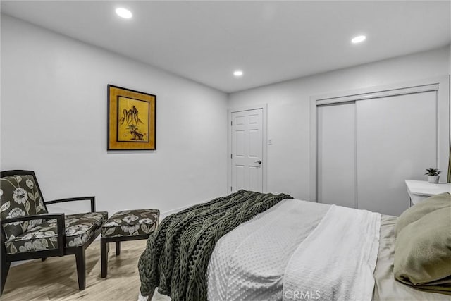 2255 Cota Ave, Long Beach, CA 90810 - bedroom with light wood-type flooring, recessed lighting, and a closet