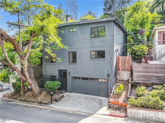3735 Division St, Los Angeles, CA 90065 - view of front of property featuring an attached garage, stucco siding, and concrete driveway