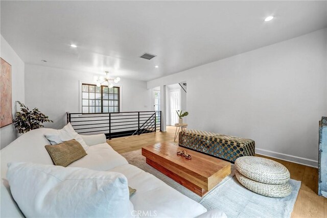 3735 Division St, Los Angeles, CA 90065 - living area with a chandelier, wood finished floors, and recessed lighting