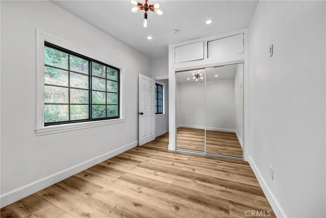 3735 Division St, Los Angeles, CA 90065 - unfurnished bedroom featuring a chandelier, light wood finished floors, recessed lighting, and a closet