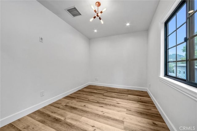 3735 Division St, Los Angeles, CA 90065 - empty room featuring a chandelier, wood finished floors, and recessed lighting