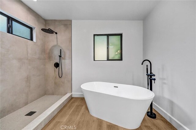 3735 Division St, Los Angeles, CA 90065 - full bath featuring wood finished floors, a tile shower, and a freestanding tub