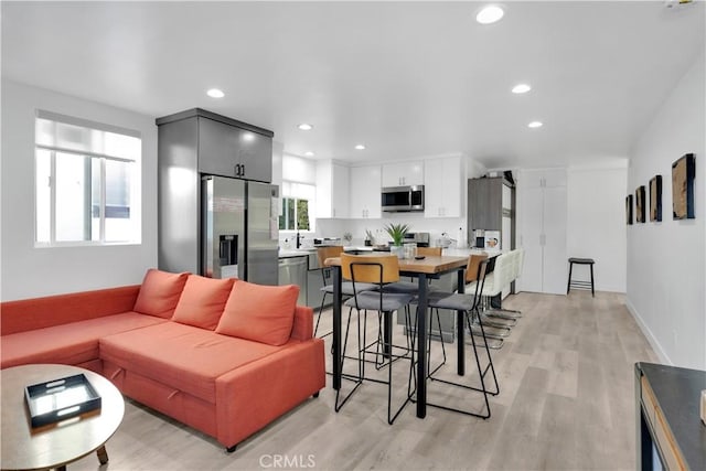 5226 W 20th St, Los Angeles, CA 90016 - living room featuring light wood-type flooring and recessed lighting