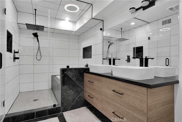 5226 W 20th St, Los Angeles, CA 90016 - bathroom with tile walls, a stall shower, vanity, and tile patterned floors