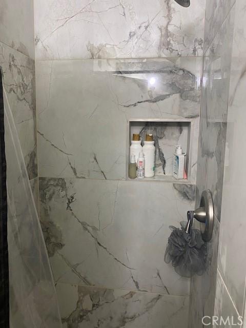 1303 N Siesta Ave, La Puente, CA 91746 - bathroom with a marble finish shower