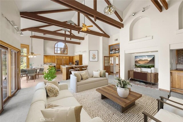 7580 E Martella Ln, Anaheim Hills, CA 92808 - living area featuring high vaulted ceiling, ceiling fan, beam ceiling, and light colored carpet