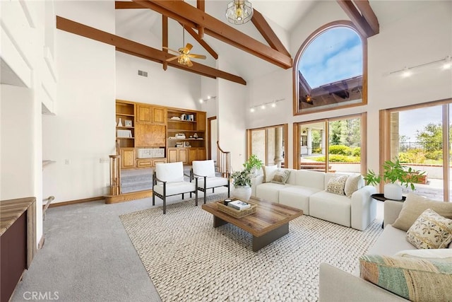 7580 E Martella Ln, Anaheim Hills, CA 92808 - carpeted living area with high vaulted ceiling, ceiling fan, beam ceiling, and track lighting