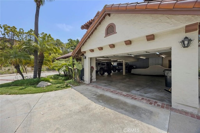 7580 E Martella Ln, Anaheim Hills, CA 92808 - view of side of property featuring driveway, a garage, and a tiled roof