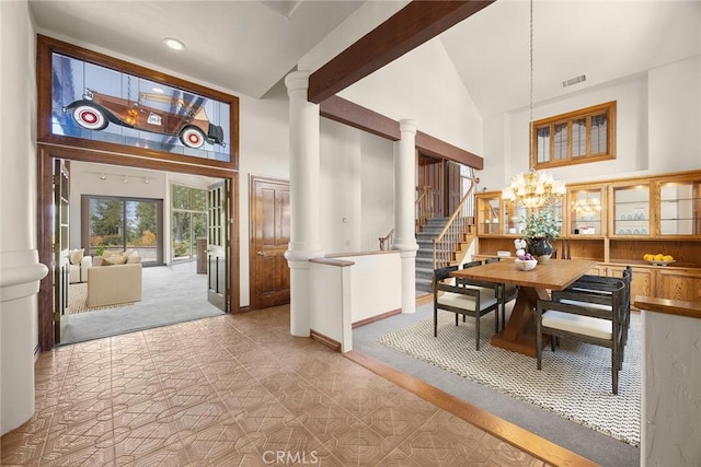 7580 E Martella Ln, Anaheim Hills, CA 92808 - carpeted dining room with high vaulted ceiling, ornate columns, a chandelier, recessed lighting, and stairway