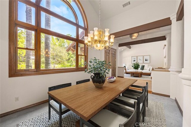 7580 E Martella Ln, Anaheim Hills, CA 92808 - dining space featuring light colored carpet, plenty of natural light, a chandelier, and ornate columns