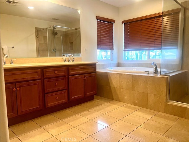 6715 Meriwether Ct, Rancho Cucamonga, CA 91701 - full bath featuring tile patterned floors, double vanity, a shower stall, and a bath