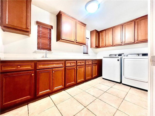 6715 Meriwether Ct, Rancho Cucamonga, CA 91701 - washroom featuring washer and clothes dryer, cabinet space, and light tile patterned floors