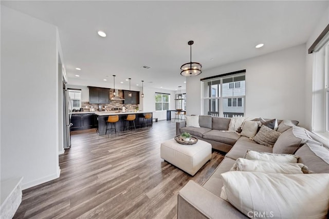 23 Vasto St, Rancho Mission Viejo, CA 92694 - living area with recessed lighting, wood finished floors, and a chandelier