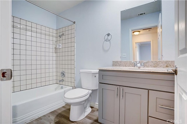 28931 Bradley Rd, Menifee, CA 92586 - bathroom featuring vanity, tub / shower combination, and wood finished floors