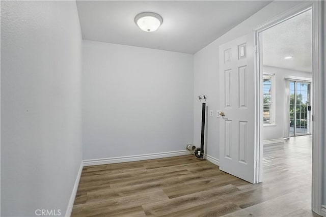 28931 Bradley Rd, Menifee, CA 92586 - washroom featuring wood finished floors and baseboards