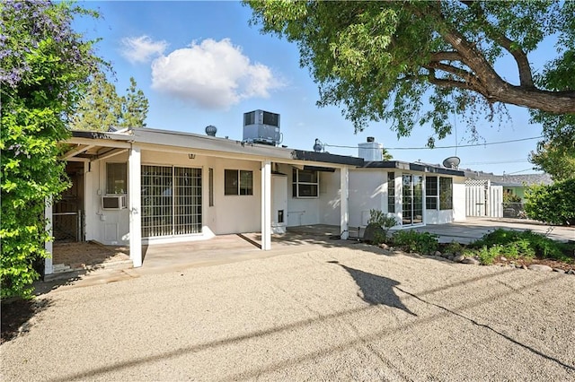28931 Bradley Rd, Menifee, CA 92586 - rear view of property featuring a patio area, cooling unit, and stucco siding