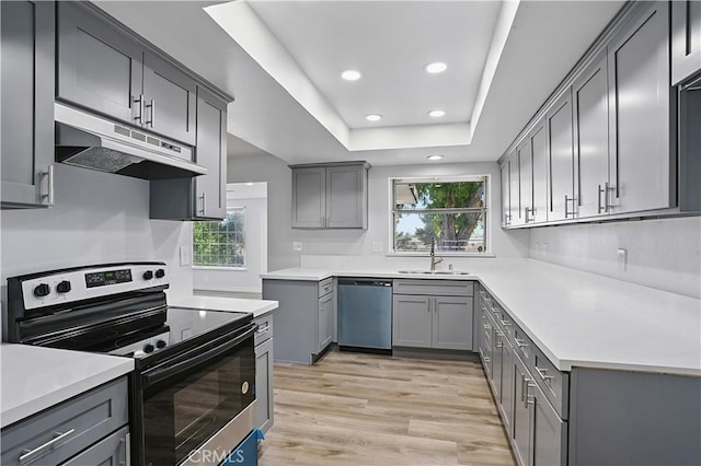 28931 Bradley Rd, Menifee, CA 92586 - kitchen with appliances with stainless steel finishes, under cabinet range hood, gray cabinetry, recessed lighting, and healthy amount of natural light