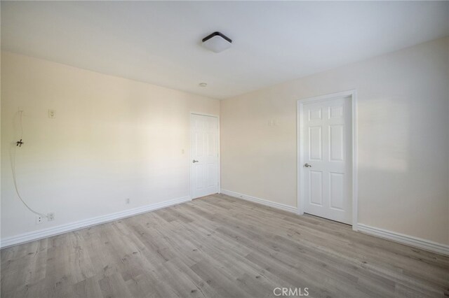 1038 N Columbus Ave, Glendale, CA 91202 - empty room featuring wood finished floors and baseboards