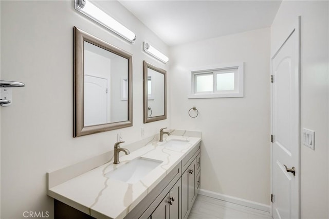 1038 N Columbus Ave, Glendale, CA 91202 - bathroom with double vanity and marble finish floors