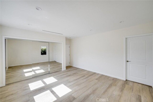 1038 N Columbus Ave, Glendale, CA 91202 - unfurnished bedroom with wood finished floors and a closet