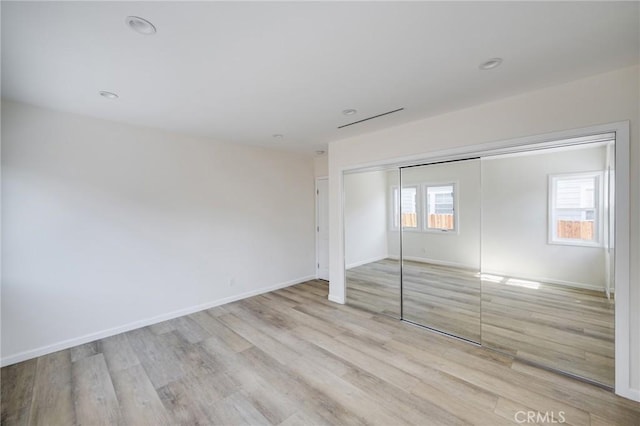 1038 N Columbus Ave, Glendale, CA 91202 - unfurnished bedroom with light wood-style flooring and a closet
