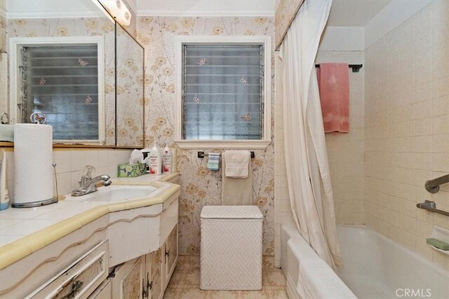 6014 Eckleson St, Lakewood, CA 90713 - bathroom featuring vanity, wallpapered walls, and shower / tub combo