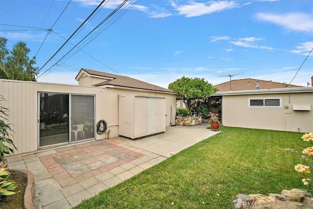 6014 Eckleson St, Lakewood, CA 90713 - view of grassy yard with a patio and an outbuilding