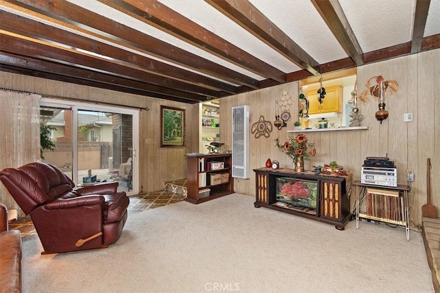 6014 Eckleson St, Lakewood, CA 90713 - living area with beamed ceiling, a heating unit, wood walls, and carpet