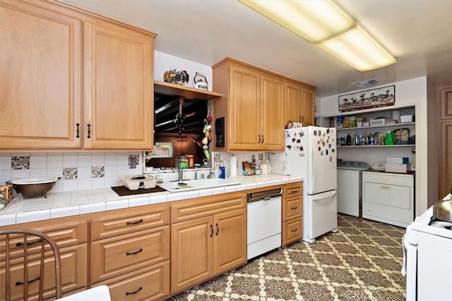 6014 Eckleson St, Lakewood, CA 90713 - kitchen featuring open shelves, white appliances, washing machine and dryer, and backsplash