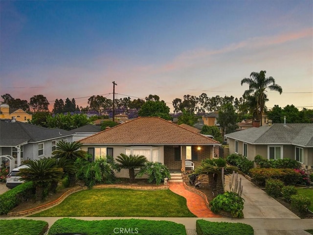 6014 Eckleson St, Lakewood, CA 90713 - ranch-style home with a yard, a porch, and concrete driveway
