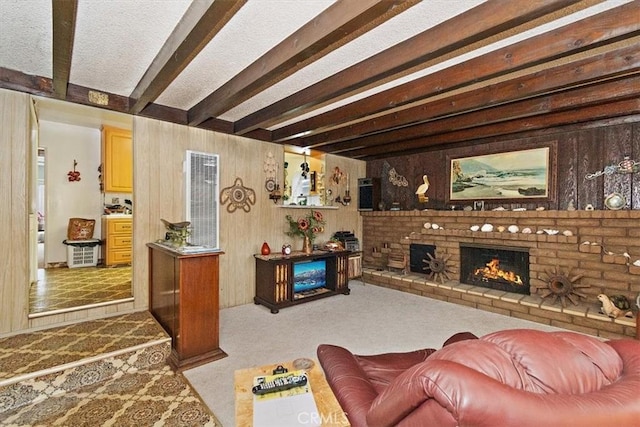 6014 Eckleson St, Lakewood, CA 90713 - carpeted living area with beam ceiling, wooden walls, a heating unit, and a fireplace