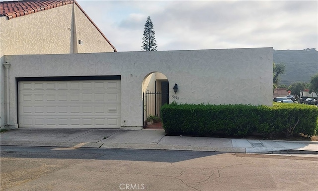 30828 Calle Chueca, San Juan Capistrano, CA 92675 - view of front of home featuring stucco siding, a garage, and driveway