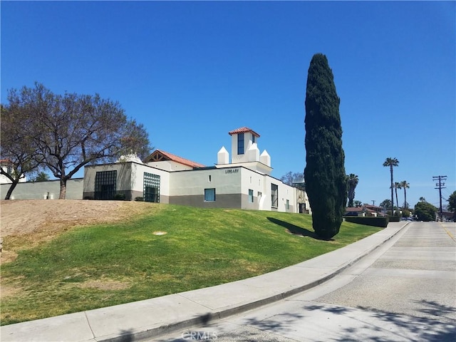 30828 Calle Chueca, San Juan Capistrano, CA 92675 - view of property exterior with stucco siding and a yard