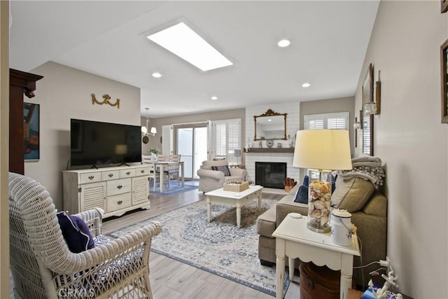 30828 Calle Chueca, San Juan Capistrano, CA 92675 - living area with wood finished floors, a brick fireplace, and recessed lighting