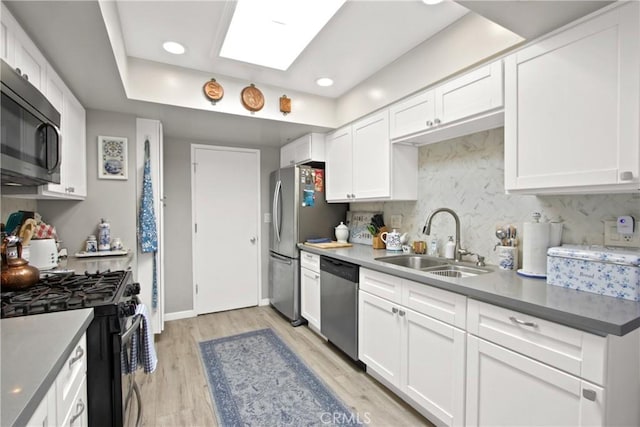 30828 Calle Chueca, San Juan Capistrano, CA 92675 - kitchen featuring stainless steel appliances, backsplash, white cabinets, light wood-type flooring, and recessed lighting