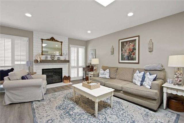 30828 Calle Chueca, San Juan Capistrano, CA 92675 - living room featuring wood finished floors, a fireplace, and recessed lighting