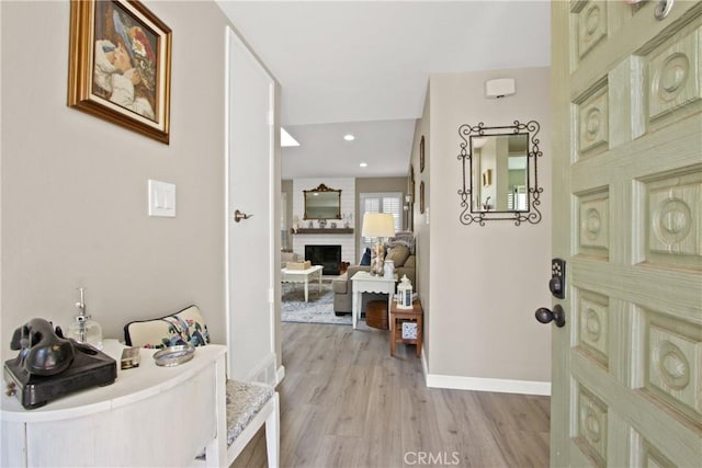30828 Calle Chueca, San Juan Capistrano, CA 92675 - entryway with a large fireplace, light wood-type flooring, and recessed lighting