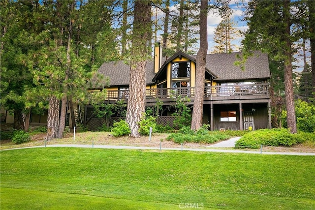 361 Riviera Dr, Lake Arrowhead, CA 92352 - rear view of property featuring a lawn, a wooden deck, a chimney, and roof with shingles
